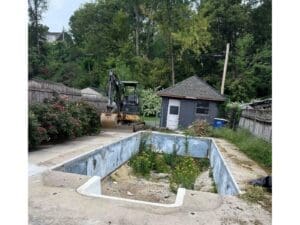 Excavation work for a backyard pool removal project